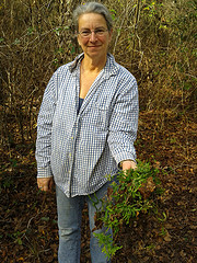 Gretchen with uprooted Japanese climbing fern
