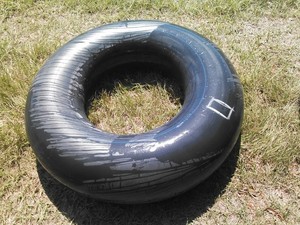 300x225 Tire, in Flat tractor tire, by John S. Quarterman, for OkraParadiseFarms.com, 3 September 2014