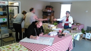 Tom Keuttner delivering food to Gretchen Quarterman