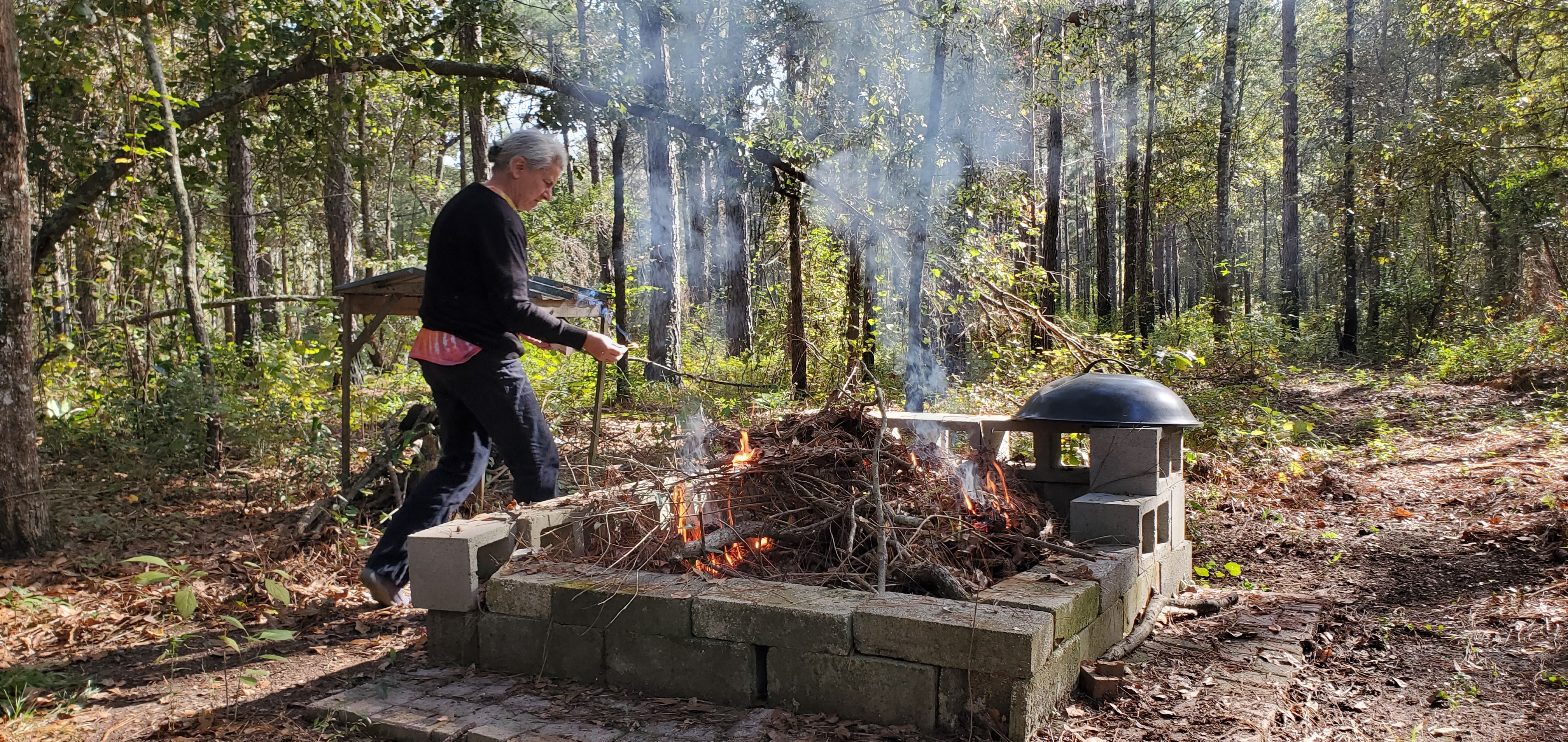 Gretchen feeding the fire