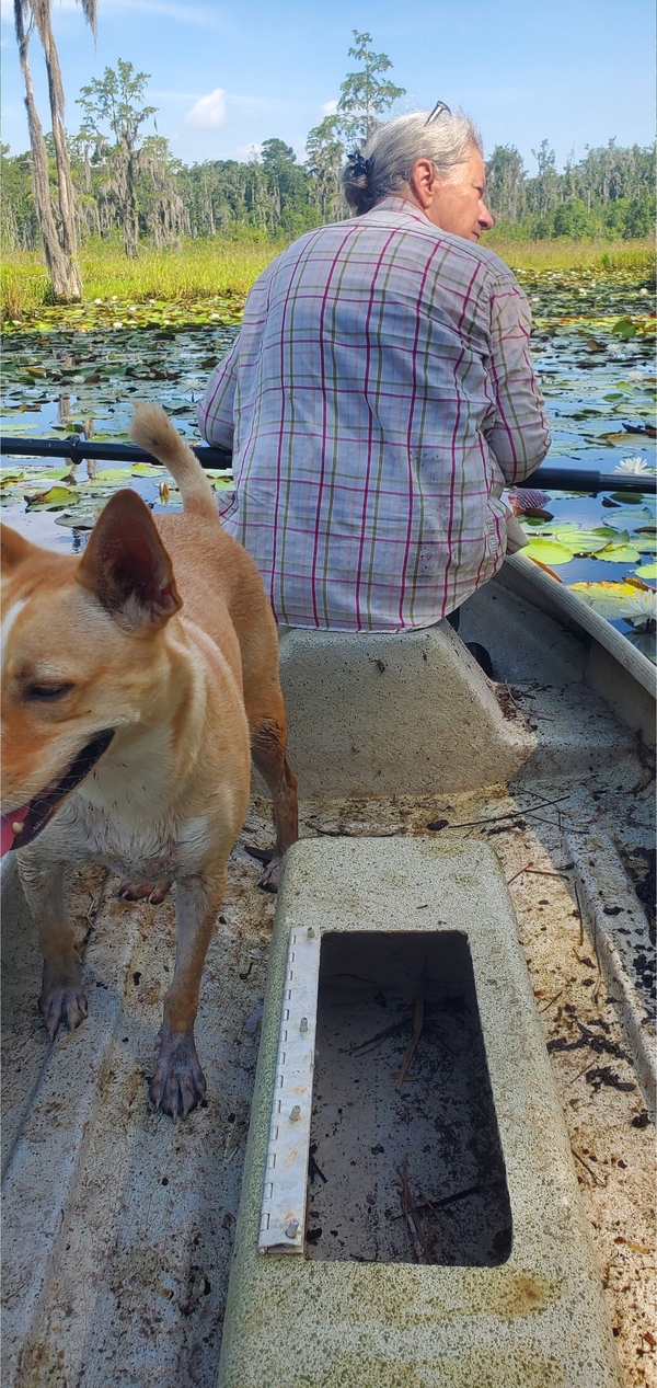 Grinning Blondie in the boat